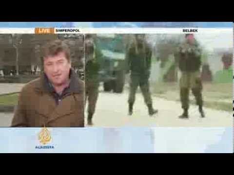 Tense confrontation in Crimea as soldiers fire warning shots