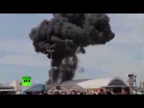 Dramatic footage: Vintage stunt plane crashes outside Madrid at aerobatics show