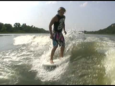 Keenan riding behind a Centurion on Inland Surfer board