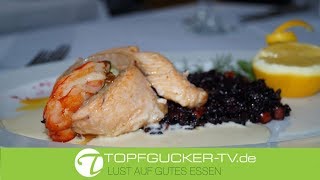 Lachsforelle im Kreis, Risotto vom schwarzen Reis an Soße von Agrumen Lachsforelle im Kreis, Risotto vom schwarzen Reis an Soße von Agrumen