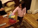 Calista playing with her new globe