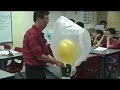 Helium filled balloon sinks in Helium environment
