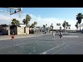 Diego and Natalia.  Basketball shot.  Venice Beach, California.  Daytime.