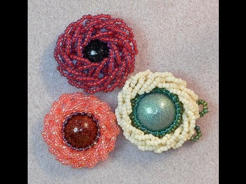 tsummerlee - These raised beaded flowers were made with a small cabochon, Peltex (Pellon), size 11/0 and 15/0 seed beads, 8 lb. Fireline, and a size 12 beading needle. Ea...