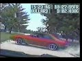 Police car chases red mustang