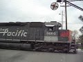 a trio of mk rebuilt sd40m-2's street running on 9th street in colton, ca over former pacific electric territory.

crossings protected by mechanical flagman 