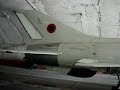 inside a shelter in rinas afb albania. the two fighters are f-7a or the chinese copy of the mig-21f-13. must say that maneuverability is better then mig-21pf, although it lack of power. the engines shown are two wp-6 (rd-9bf-811)from a f-6c

ne shqip
avioni i tipit chengdu f-7 eshte marre nga republika popullore e kines ne fillimet e viteve 70te. gjithsej u moren 12 cope nga linja e pare e prodhimit per kete tip ne kine. keshtu ky eshte versioni i hershem i kesaj familje gjuajtesisht qe ne vetvete jane derivat te versionit fillestar te fantastikut mig-21 qe emertohej fillimisht mig-21/f-13 per shkak te motorrit tumanskiy f-13. ky tip ka qene avioni me modern qe kane disponuar forcat tona ajrore deri ne diten e terheqjes nga sherbimi ne 2005n. ishte i vetmi avion qe ishte ne gjendje te leshonte rraketa ajer-ajer te rrezes se shkurter tip pl-2 nje kopje kineze e atoll-2 sovjetike. me kete avion fluturonin pilotet me te mire te aviacionit luftarak shqipetar. ka vepruar kryesisht ne rolin e gjuajtes-kapesit per shkak te performances superiore kundrejt gjuajtesve te tjere qe dispononim. nga ana e fluturimit, ishte nje avion i manovrueshem sidomos ne shpejtesite e nje luftimi te ngushte ajror. per shkak te sistemit konvencional te komandimit, manovrimi veshtiresohej ne shpejtesi te larta fluturimi. ulja kishte veshtiresi pasi sistemi i uljes ishte i ngushte dhe mund te permbusej lehte. per tu theksuar eshte fakti se ashtu si edhe me gjuajtesin kryesor te forcave tona ajrore f-6/mig-19, pilotet kalonin direkt ne fluturim solo pasi nuk dispononim version dyvendesh. ky gjuajtes ka sherbyer kryesisht nga aerodromi i gjadrit me regjimentin 4010 dhe me pak me ate te rinasit (ne nje periudhe te shkurter kohore).
