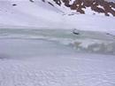 Alpine-Skiing in winter-resort Davos-Parsenn across a pool of water. Sudden crash, falling on the butt and spinning on the surface on the back.