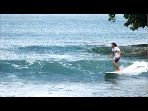husni - Indonesian longboarder Husni Ridwan surfing his home break in Batukaras, Java.