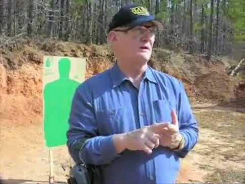 chl - Rol Coggins, Texas Concealed Handgun Course Instructor explains the Texas Course of Fire while Richard Schultz shoots a perfect score of 250 at the Longview ...