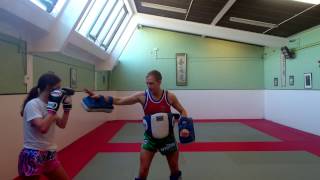 Client pad work and Muay Thai striking