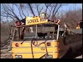 this is a school bus that is being ripped appart, with a backhoe, this is our job.ain't it great!!!