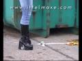 Yoghurt pot smashed under her kneehigh boots
