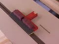 dallas model works flat car loader in action loading an ho scale flat car.