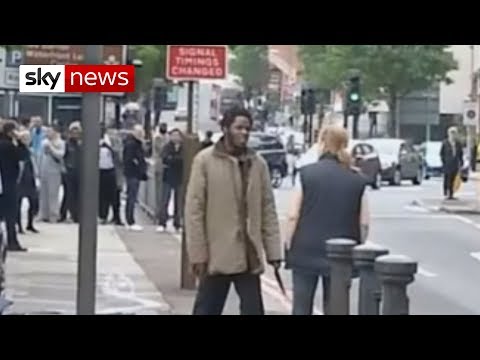 Film - Two suspects are in a serious condition in hospital after armed police shot them following the killing of a serving soldier. Witnesses said they set about th...