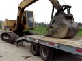 excavator loading on tag trailer