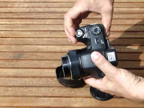 how to attach lens cap to sony hx100v