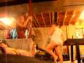 two hot young  pigs dancing on poles in their underwear