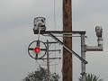 a trio of mk rebuilt sd40m-2's street running over 9th street in colton, ca over former pacific electric territory.

crossings protected by mechanical flagman 