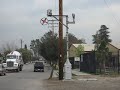 a trio of mk rebuilt sd40m-2's street running over 9th street in colton, ca over former pacific electric territory.

crossings protected by mechanical flagman 