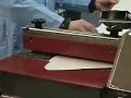 Gluing Fabric to Paperboard with Roll Coater and Glue Gun Gluing Fabric to Paperboard with Roll Coater and Glue Gun
