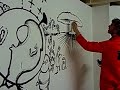 Tom M-J painting a mural at Meltdown Comics, LA