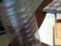 coin through bottle trick-revealved