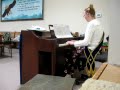 Joanie playing piano at Irving Grange