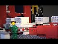 Lego Mindstorms Automated Warehouse with 2 stacker cranes and infeed/outfeed chain conveyors. Built for Logistics Link exhibition 2006.