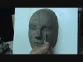 Sculpting a face in clay