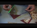 Published quilting author Karen Sievert demonstrates how to make prairie points and insert them into your quilting patchwork.
