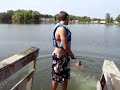 diving over people into water with a backflip ending
