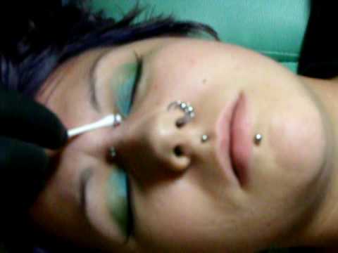 pierced - Me, getting my bridge pierced by Megan @ Wicked Needlez Custom Tattoos and Body Piercings.