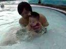 Colleen gets into the water at the swimming pool at Paladian Park