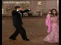Couple breaks out of slow dance to strut some moves.
