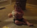 Kissing her baby doll from Grandma Nancy