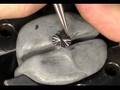 Engraving the head of a screw.