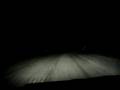 Driving into the night snow show
