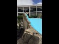 Ruben independently goes down water slide & is very proud of him