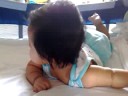 Aedan on his tummy, trying to crawl
