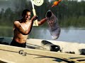Obama as a fisherman catches Ahmadinejad  as 9 a fish