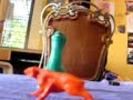 Kitty vs the green sauropod