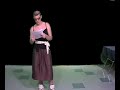 A Kid Singing In A Skirt