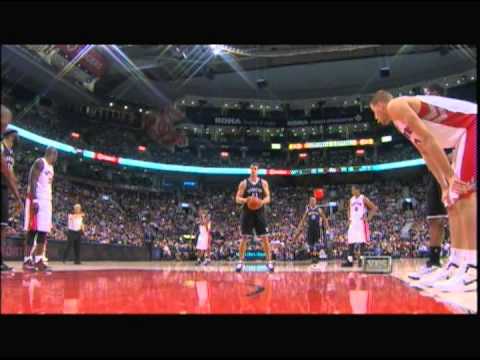 humphries - Referee Tries to Block Kris Humphries at the Free Throw Line.