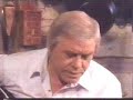 tom t. hall tells the story of the song and then hi sings it.