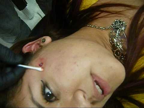 me getting my dermal piercing :D the place is no longer in business