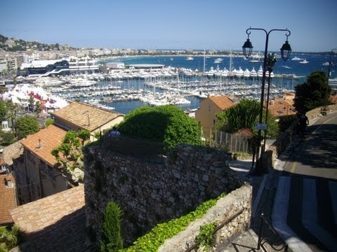 Cannes - Die Stadt Cannes mit Hafen und Burg wärend der Filmfestspiele im Mai 2012 bei Tag und Abend inclusiv Stadtrundfahrt. The city of Cannes. With harbor and cast...