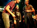 At Tábor on stage performing skákal pes and prší prší backed up by an awesome band.