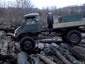 Unimog crawling over logs Unimog crawling over logs