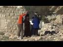 Settler shooting Palestinians in Hebron
